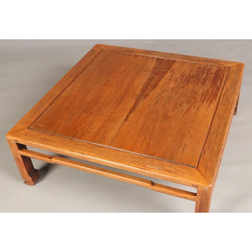 444 - An early 20th century Chinese carved hardwood square low table, 89cm square, 32cm high.