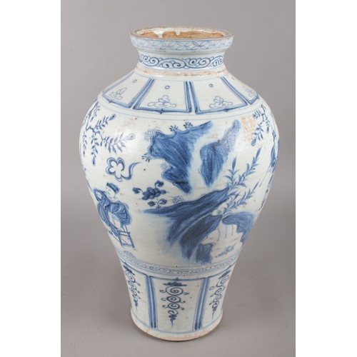 11 - A Chinese Wanli style baluster shaped blue and white vase. Painted in underglaze blue with a continu... 