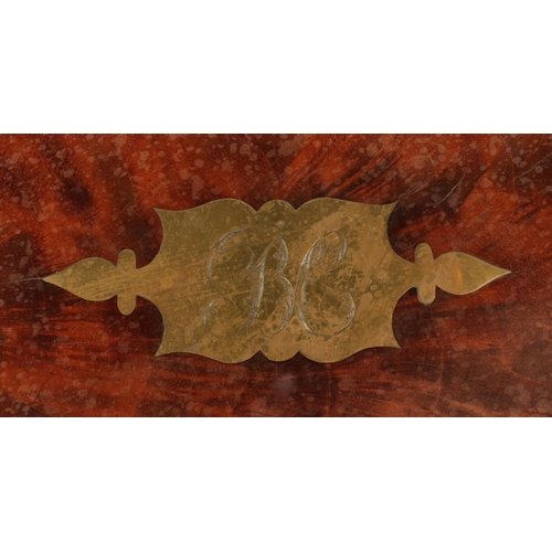 141 - A Victorian Mahogany campaign writing slope, with brass mounts to corners and straps and two handles... 