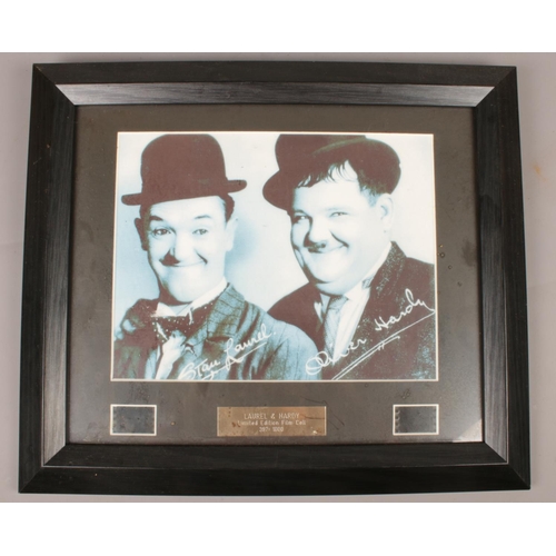 114 - A quantity of Laurel & Hardy memorabilia. Including framed limited edition pieces of film with COA, ... 