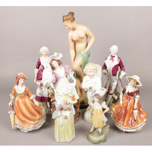 68 - A quantity of ceramic figures. Including large plaster cast semi nude maiden, etc.