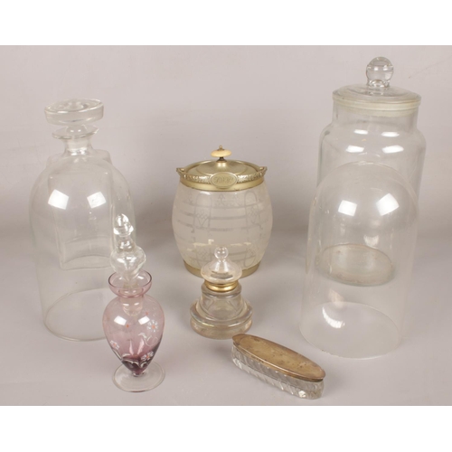 74 - A quantity of mostly glassware. Including glass dome, biscuit barrel, decanter, etc.