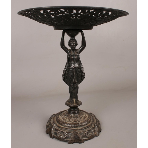 88 - A cast iron 'Lady Tessa' centrepiece. Decorated in a classical style.  H: 34cm, W: 29cm.