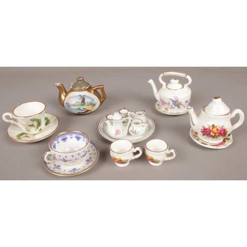 89 - A quantity of miniature ceramic teawares. Including full teaset, cups & saucers, teapots, etc.