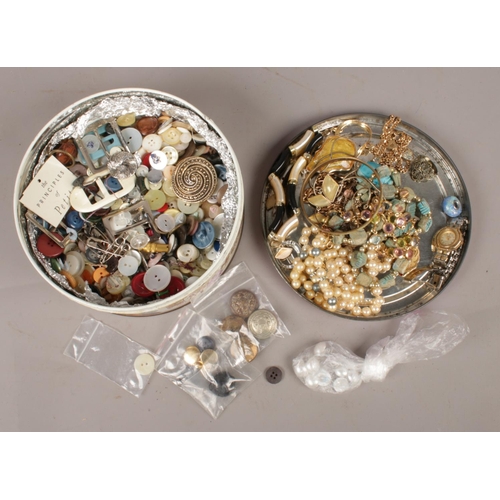 106 - A quantity of costume jewellery and a collection of buttons.