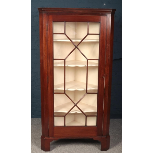 596 - A large Victorian mahogany astrigal glazed corner cupboard. (Height 199cm Width 100cm Depth 59cm).