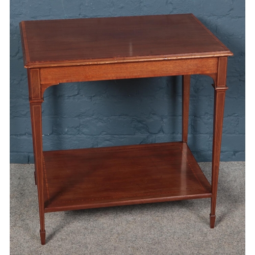 597 - An Edwardian mahogany two tier side table.