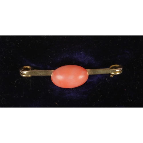 400 - A 9ct gold and coral brooch.