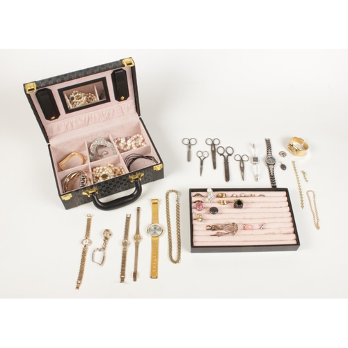 182 - An assortment of costume jewellery presented in a small briefcase. Comprising of two gold plated lad... 