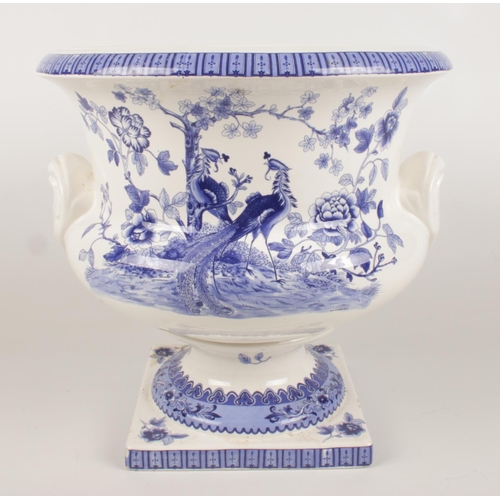 186 - A large ceramic blue & white planter with transfer print decoration depicting peacocks and flowers. ... 