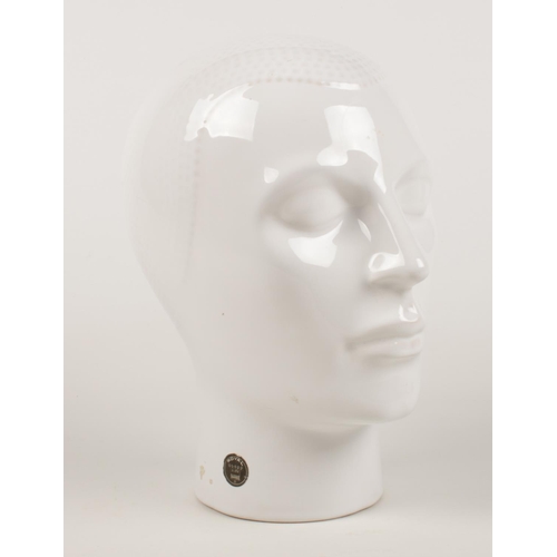 193 - A white glazed ceramic bust of a male head. With 