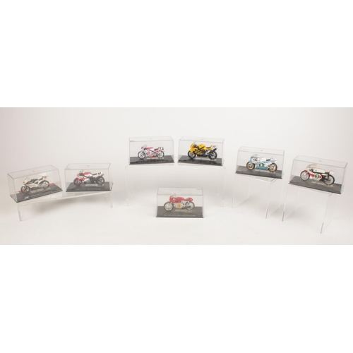 201 - A collection of seven boxed diecast models of motorbikes - comprising of a Yamaha RD05 250 Phil Read... 