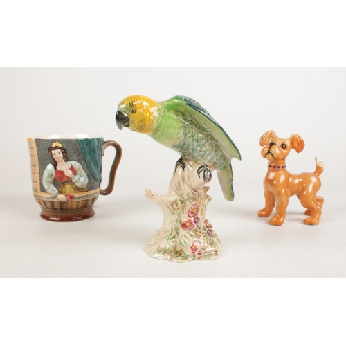 209 - A group of Beswick ceramic's. A Parakeet No. 930, Romeo & Juliet themed mug No 1215 & a dog.