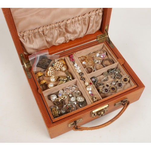 223 - A jewellery box and contents of costume jewellery. Includes rings, silver gilt cubic zirconia solita... 