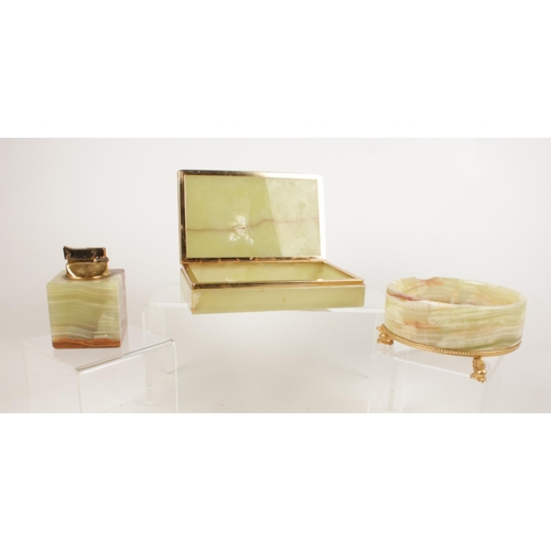225 - Three pieces of onyx - to include a cubed lighter, a hinged trinket box and circular dish mounted up... 