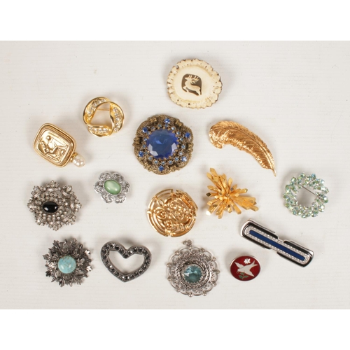 226 - A collection of costume jewellery brooches. Includes silver and enamel dove of peace brooch, Monet, ... 