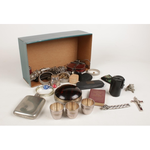 231 - A box of collectables. Including hipflask, pendants, small bear trinket, etc.
