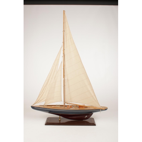 240 - A large wooden model of a sail boat. (Height 85cm).
