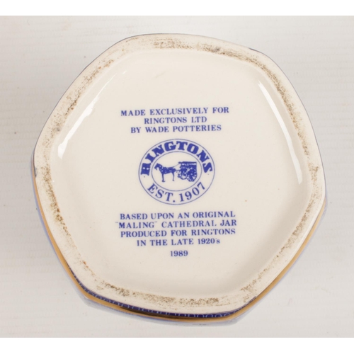 243 - A 'Wade' blue and white lidded hexagonal tea caddie for Ringtons tea. Decorated with various cathedr... 