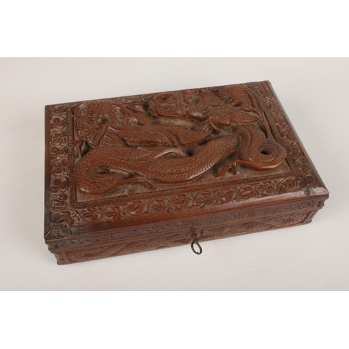 285 - A oriental hardwood carved jewellery box. with key (29cm width, 17cm width)