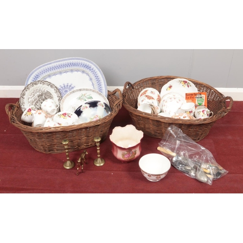 365 - Two wicker baskets with contents of miscellaneous. Includes bone china tea sets, large meat plate, c... 