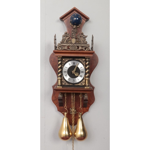 369 - A Dutch wall clock. With brass weights and pendulum.