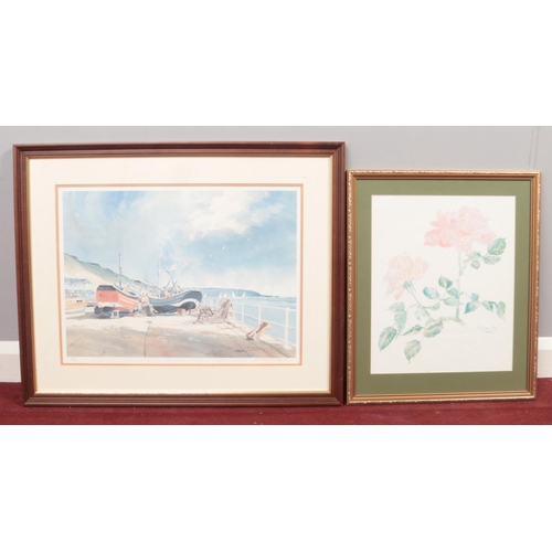 392 - Two framed and glazed prints - comprising of a still life of roses by E North & a sea scape scene wi... 