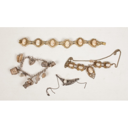 402 - A small collection of vintage jewellery. Includes filigree and cameo necklace and matching bracelet,... 