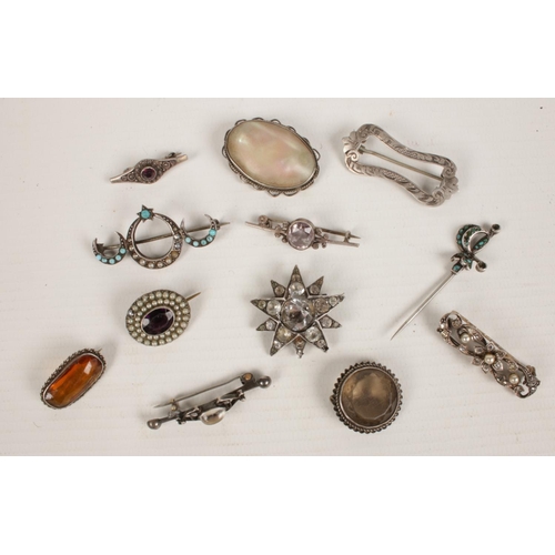403 - 12 silver brooches. Paste set examples etc.