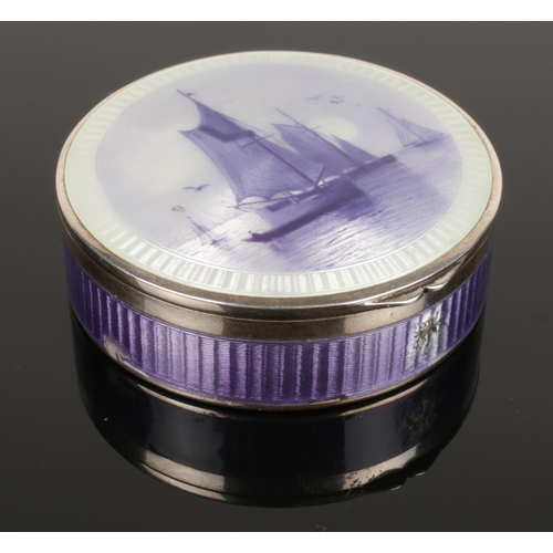 404 - A circular silver enamelled pill box decorated with sailboats. Import marks for London 1923.