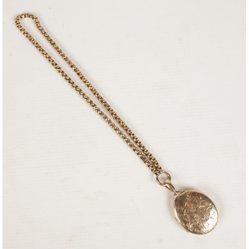 411 - A yellow metal Victorian locket & chain.