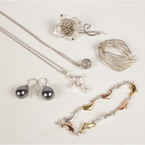 412 - A quantity of silver jewellery. Including brooches, pendants on chain, bracelet, earrings, etc.