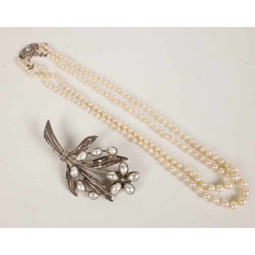 418 - A row of 2 cultured pearl necklace along with a silver pearl brooch.