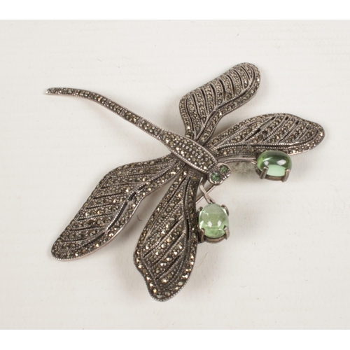 419 - A silver marcasite dragonfly brooch with articulated wings.