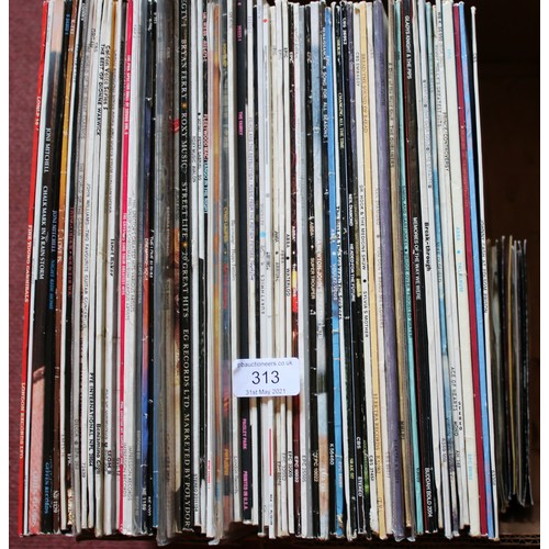 313 - A collection of vinyl L.P. records. ABBA, Prince, U2, Dire Straits, Johnny Cash examples etc.