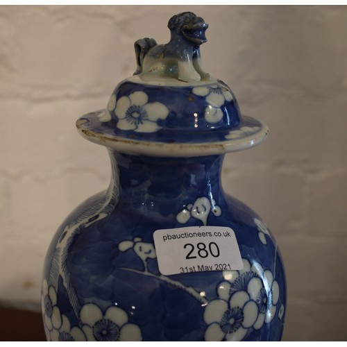 280 - An early 20th Century Chinese blue and white prunus blossom covered baluster vase. H: 33cm.