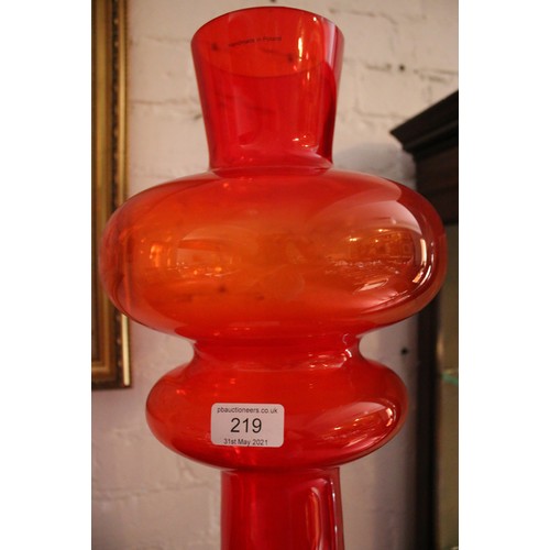 219 - A large decorative red glass vase. Handmade in Poland. (70cm).