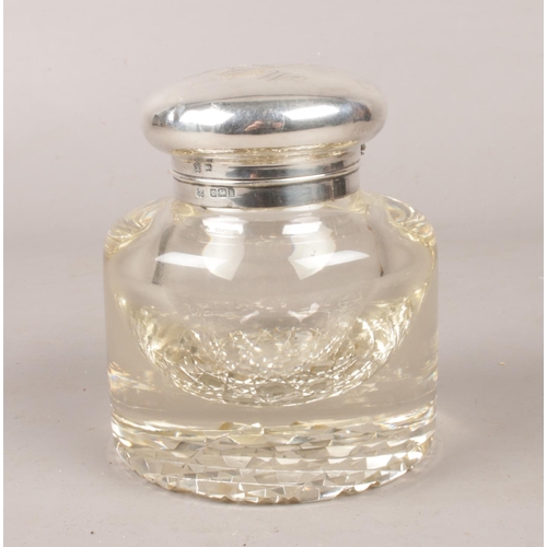 461 - A silver topped glass ink well. Assayed Sheffield 1902 by Boardman, Glossop & Co Ltd.