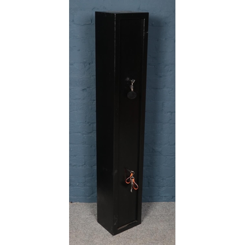 536 - A black steel gun cabinet. Dual locking with interior lockable compartment. (Height 145cm Width 25cm... 