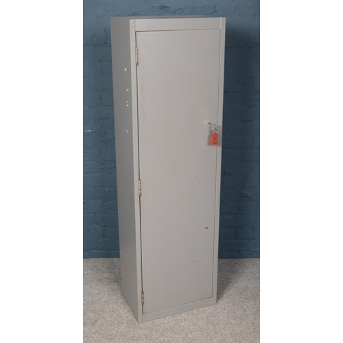 537 - A grey steel gun cabinet. Dual locking with interior lockable compartment. (Height 153cm, Width 46cm... 