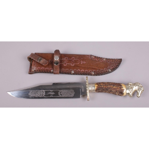 421 - A James & Lowe commemorative United States Volunteers bowie knife. With horse head pommel. In leathe... 