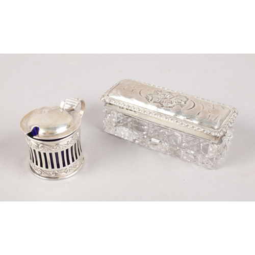 426 - Two pieces of silver. Includes a silver topped glass box with Reynolds angels decoration and a small... 