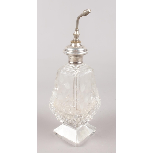 427 - A cut glass atomiser with sterling silver top. (Height 20cm).