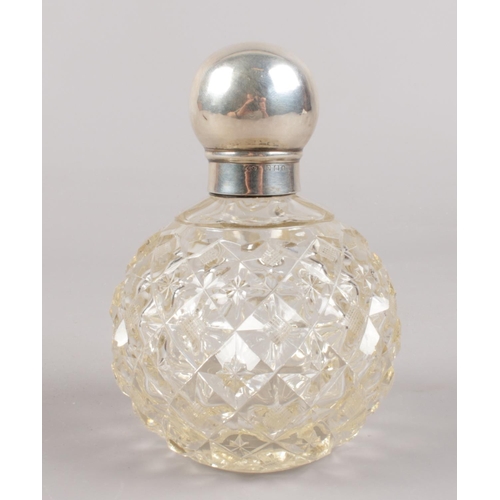 428 - A silver top globular scent bottle.