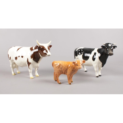 429 - A group of three Beswick cattle. To include a Brown & White horned Cow marked CH Whitehill Mandate, ... 