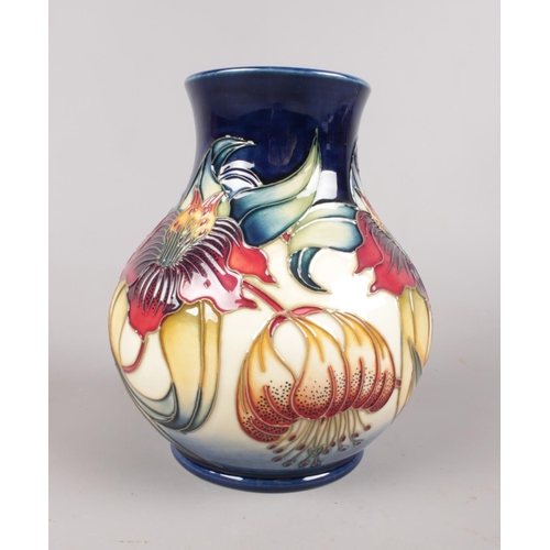 436 - A Moorcroft 'Anna Lily' vase: Designed by Nicola Slaney. H:16cm. (Unboxed)