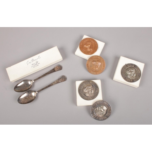 448 - A collection of mainly silver items by George Falconer & Co, Hong Kong. Includes spoons and medals.