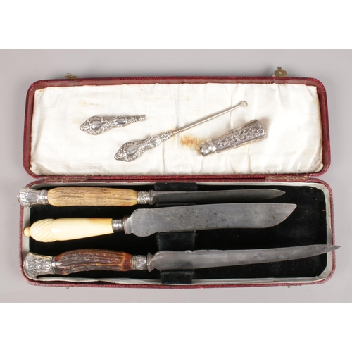 449 - A collection of silver mounted/handled items. Includes carving knives, button hook etc.