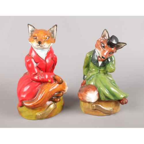 450 - A pair of Bloor China (Stoke-On-Trent) Green and Red Seated Fox Figures.
Red Figure - H:19cm
Green F... 