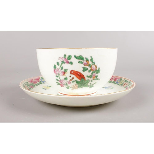 457 - A Royal Worcester hand-painted small bowl and saucer. Decorated in the Worcester parrot pattern with... 